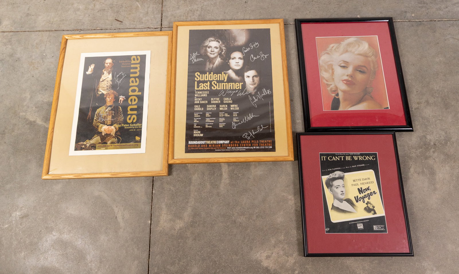 Four Pop-Culture Posters ft. Two Signed Posters: This assortment of pop culture posters features a Marilyn Monroe framed portrait print, a "Now, Voyage" vintage movie poster featuring Bette Davis, an "Amadeus" poster from Peter Schaffer's play