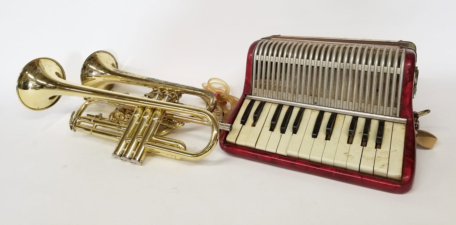Three Musical Instruments ft. Piano Accordion: Three Musical Instruments ft. Piano Accordion Size 7" x 12" x 12" Literature Brooks Auction – Online Auction Terms & Conditions