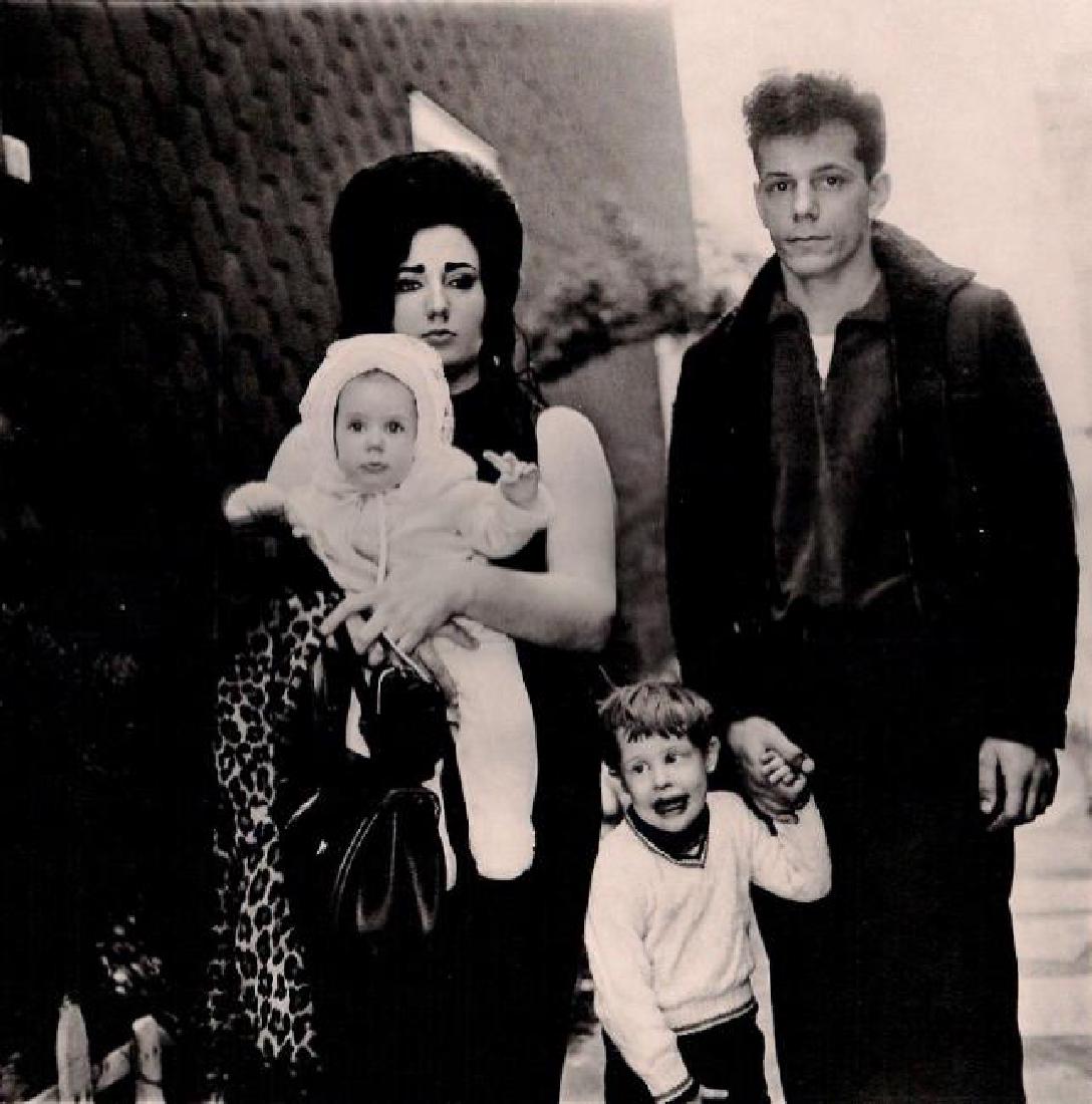 DIANE ARBUS - Young Family Outing in Brooklyn, NY 1966: Artist: DIANE ARBUS Print Title: Young Family Outing in Brooklyn, NY 1966 Medium: Heliogravure Printed in 1979, Italy Paper Size: 15 3/4 x 11 5/8 in Image Size: 9.5" x 9.5" Diane Arbus was an American