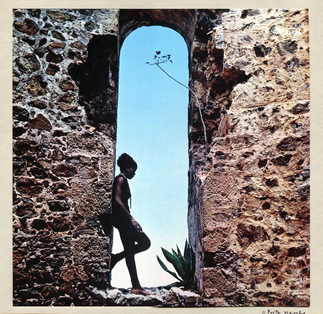 FRITZ HENLE - Nude in Sugar Mill Archway: Artist: FRITZ HENLE Print Title: Nude in Sugar Mill Archway Medium: Tipped in Color Gravure Printed in Switzerland in 1971 Sheet Size: 12" x 12" Image Size: 10" X 10" Fritz Henle was a German-born pho
