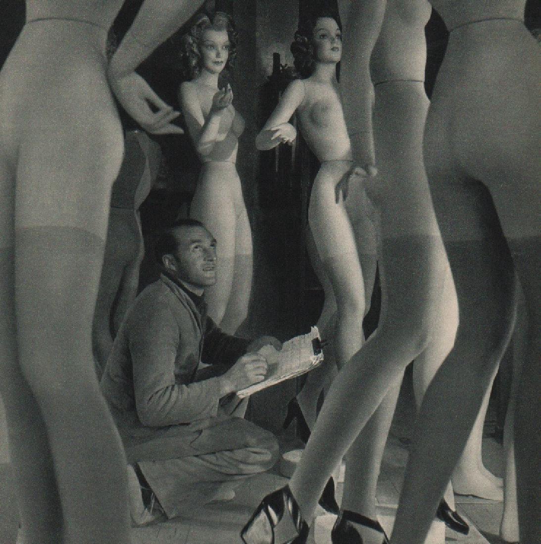 ROBERT DOISNEAU: Pierre Imans, Window Dresser: Print Title: Pierre Imans, Window Dresser Artist: Robert Doisneau Printing Date: 1956 Medium: Sheet fed copper plate gravure Printing Location: France Image Size: 7.5 x 7.5 inches Robert Doisneau was