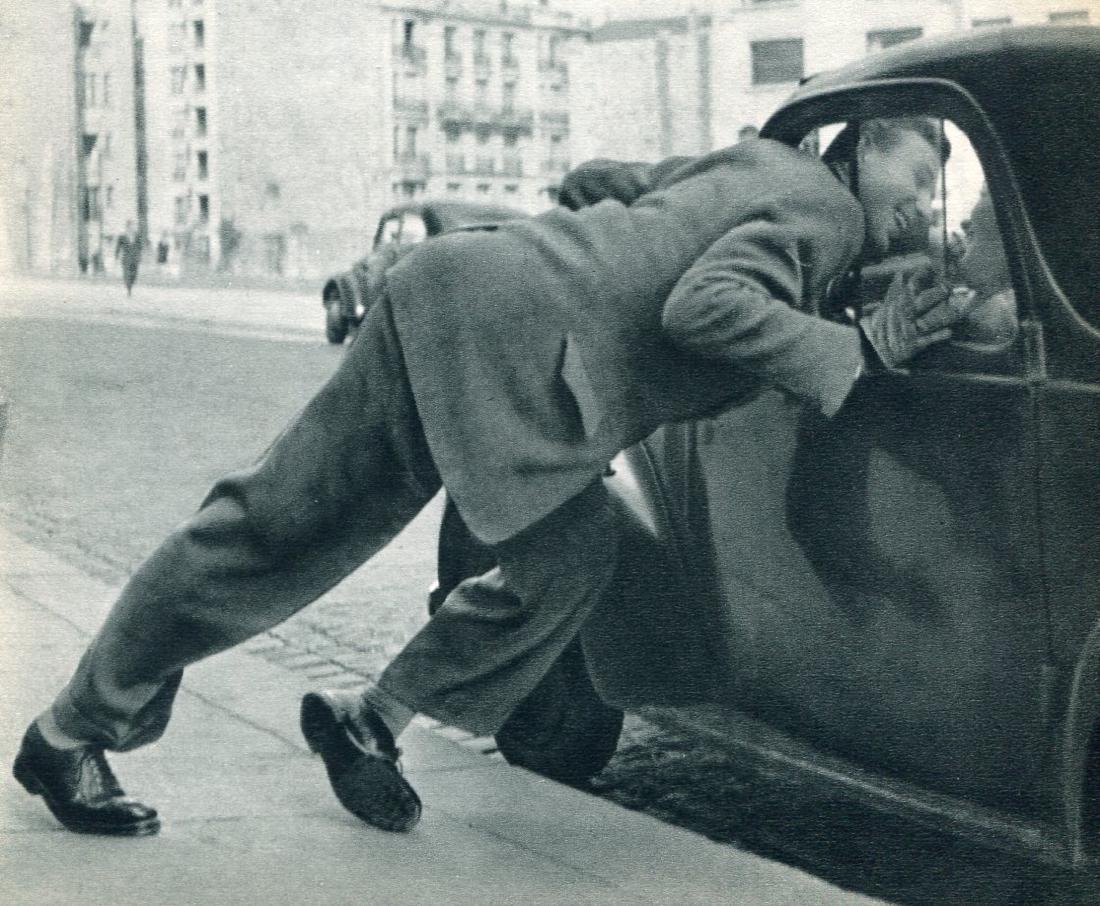 ROBERT DOISNEAU: L'Amour II: Print Title: L'Amour II Artist: Robert Doisneau Printing Date: 1956 Medium: Sheet fed copper plate gravure Printing Location: France Image Size: 7.5 x 6 inches Robert Doisneau was a French photographe