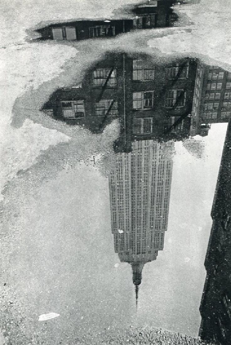 ANDRE KERTESZ: Puddle (9/17/1967), New York: Print Title: Puddle (9/17/1967), New York Artist: Andre Kertesz Medium: Sheet-Fed Gravure Printing Date: 1972 Maker: Braun - Mulhaus, France Image Size: 5.5 x 8.5 inches Andre Kertesz, born Kertesz An