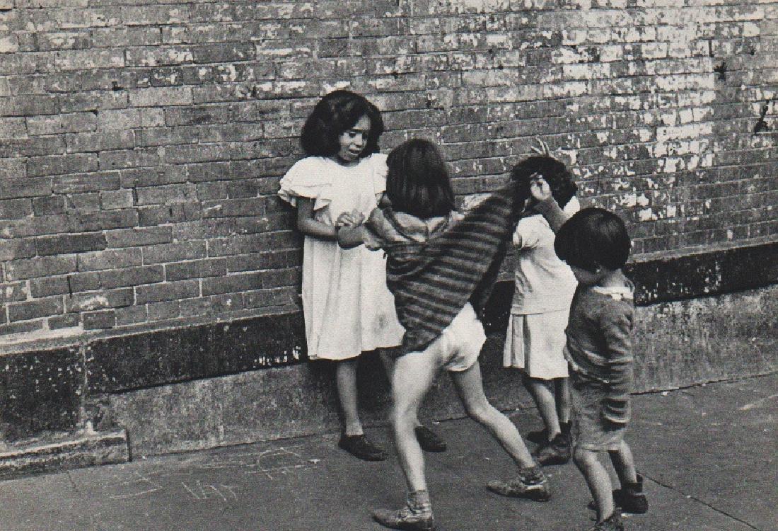 HELEN LEVITT: New York Streets I: Print Title: New York Streets I Artist: Helen Levitt Printing Date: 1965 Medium: Sheet fed Copper plate gravure Printing Location: Switzerland Image Size: 8.5 x 6 inches Helen Levitt (1913-2009) was a