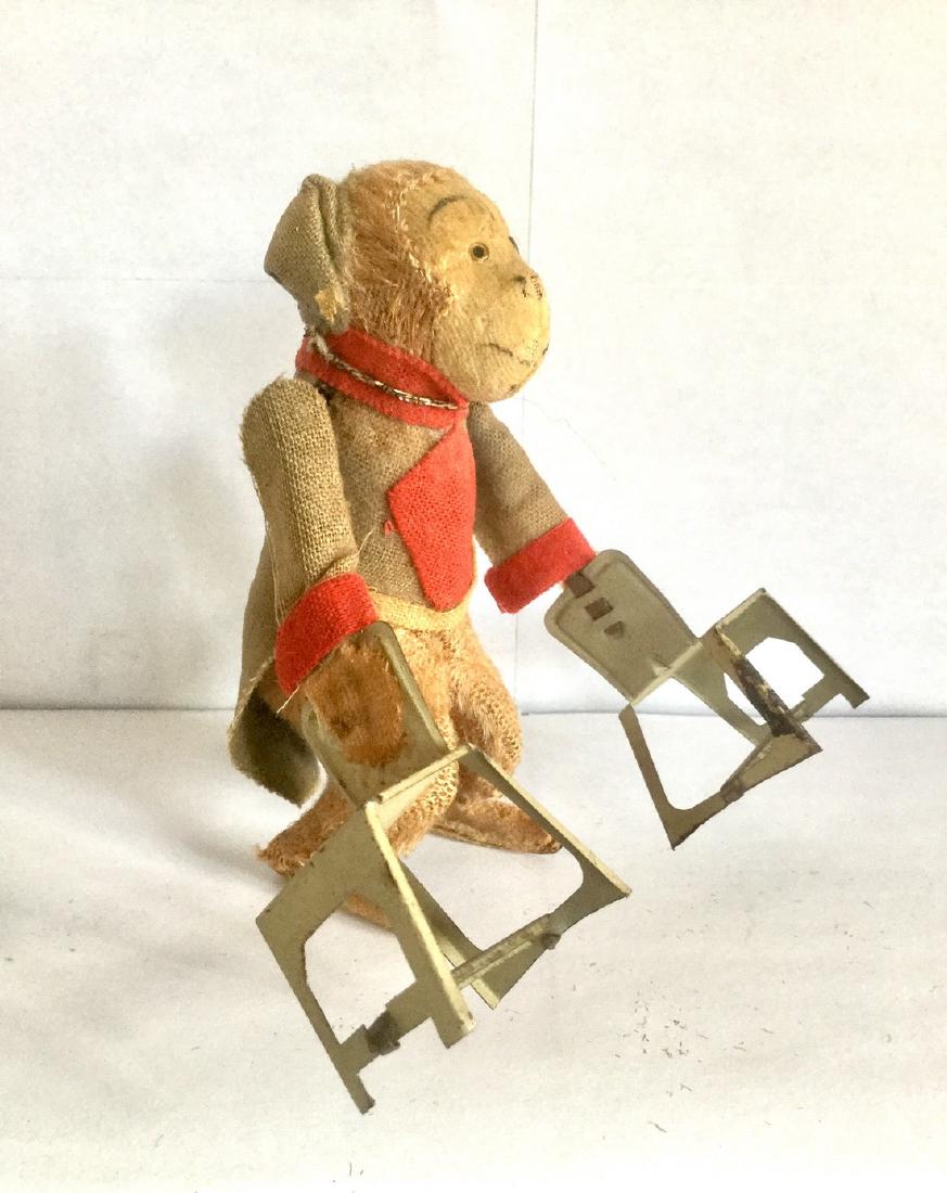 Monkey Balancing Act Wind Up Toy, 1950s: Monkey Balancing Act Wind Up Toy. Tin, Plush Velvet and Felt. Japan, 1950's. 4 3/4" tall x 4 1/2" wide x 2" deep Please note that this lot has a confidential reserve. When you leave a bid in advance o