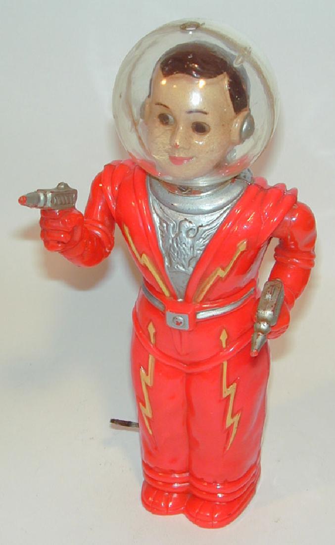 Irwin Man From Mars Windup Robot Toy, 1950s: Irwin "Man From Mars" Windup Robot Toy. 1950s Irwin Plastic Co. Red molded hard plastic, painted details in gold and silver. Metal key connected to inner workings. Wind him up, and he walks forward wi