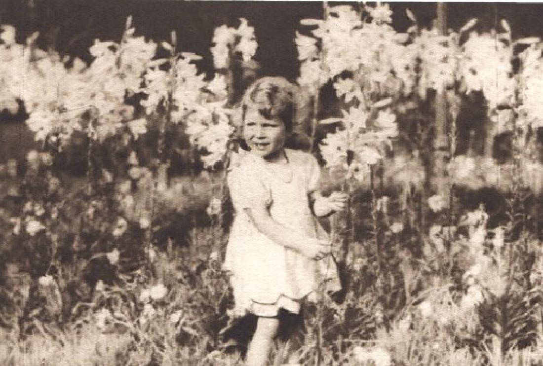 HRH THE DUKE OF YORK - Princess Elizabeth in the: Artist: HRH THE DUKE OF YORK Print Title: Princess Elizabeth in the Lillies (circa 1920s) - Queen Elizabeth II as a young child Printing Date: 1930 Medium: Sheet-fed Gravure Printed in UK Image Size: 