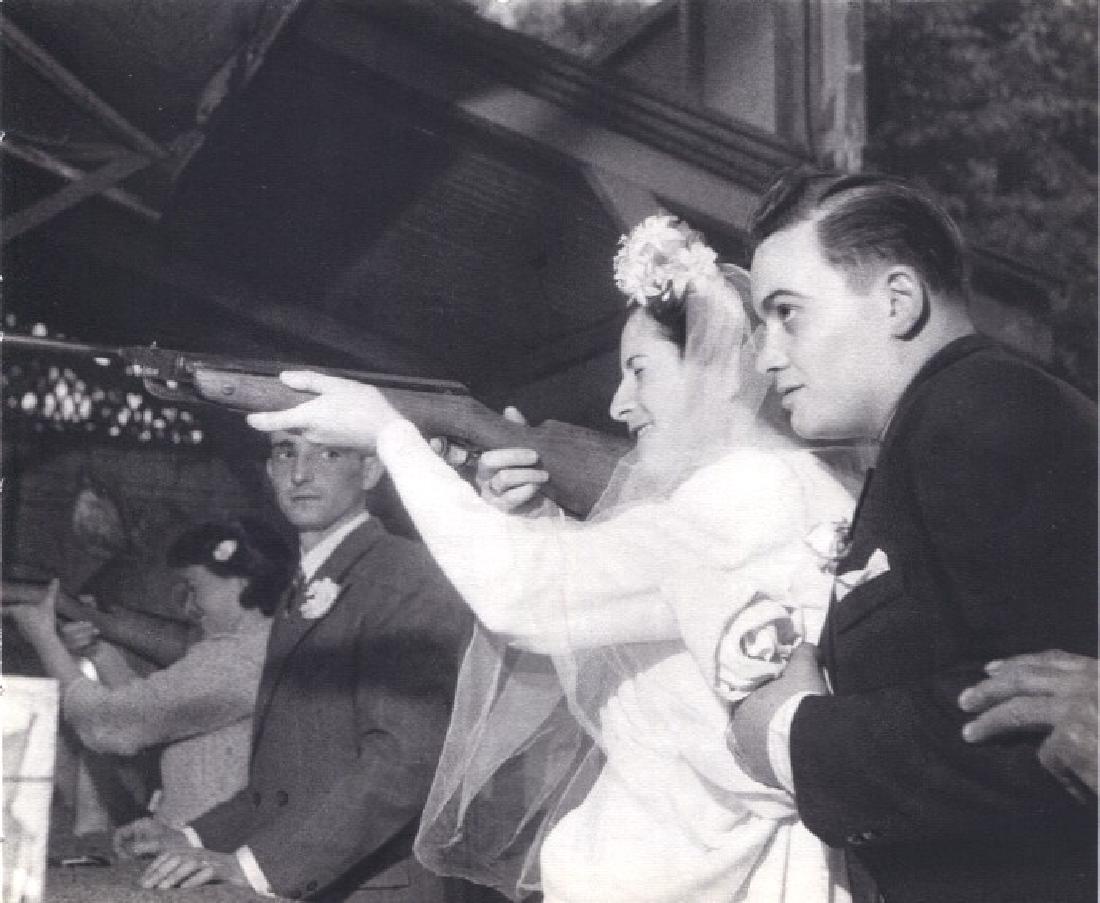 ROBERT DOISNEAU - Shotgun Wedding: Artist: ROBERT DOISNEAU Print Title: Shotgun Wedding Printing Date: 1949 Medium: Sheet-fed Gravure Printed in Switzerland Image Size: 6.5" x 5.5" Robert Doisneau was a French photographer. Similar to