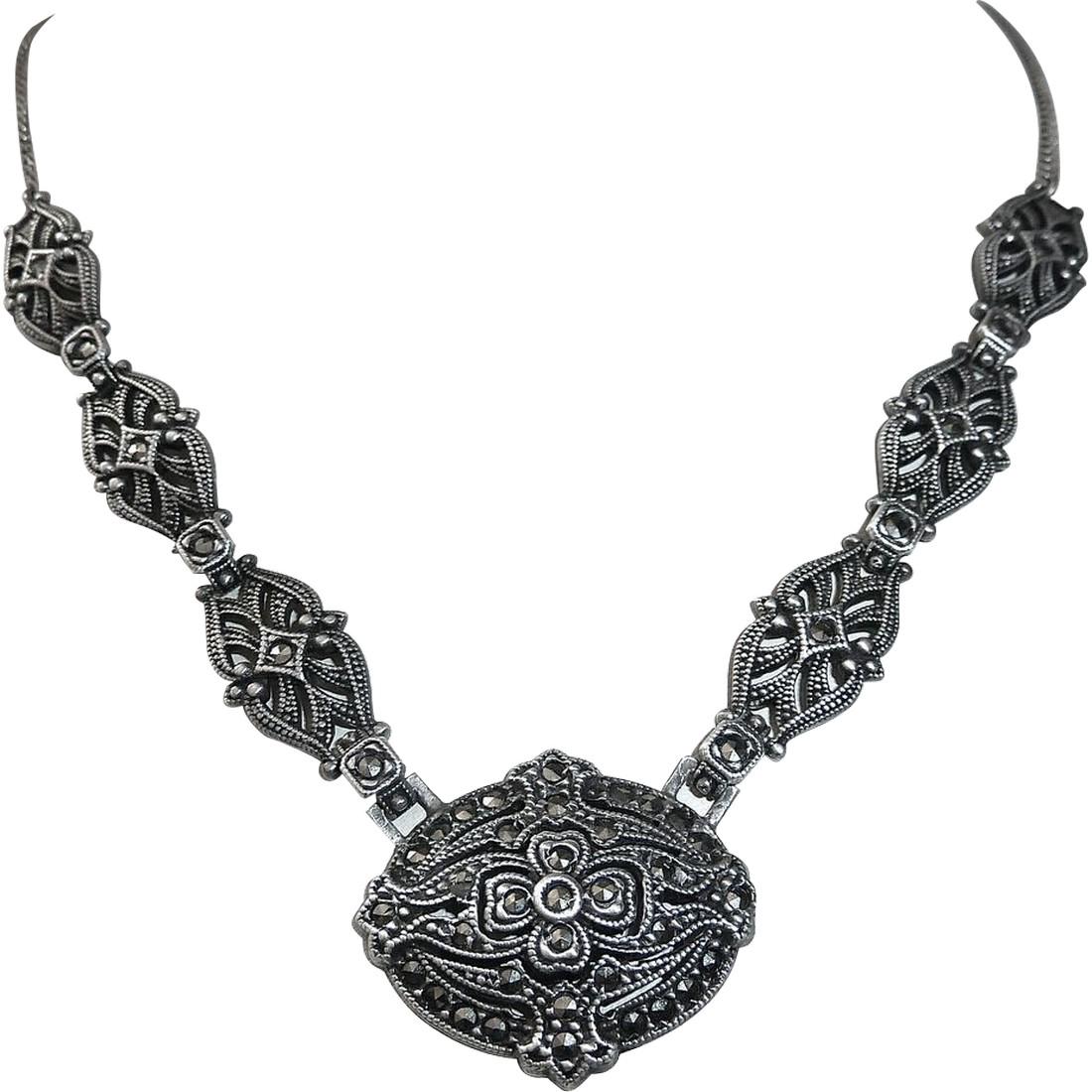 Vintage Art Deco Sterling & Marcasite Necklace: A lovely vintage Art Deco sterling and marcasite necklace c1920s. The gently domed centerpiece is layered and pierced. The geometric design sparkles with the marcasites, the lowest background layer ha