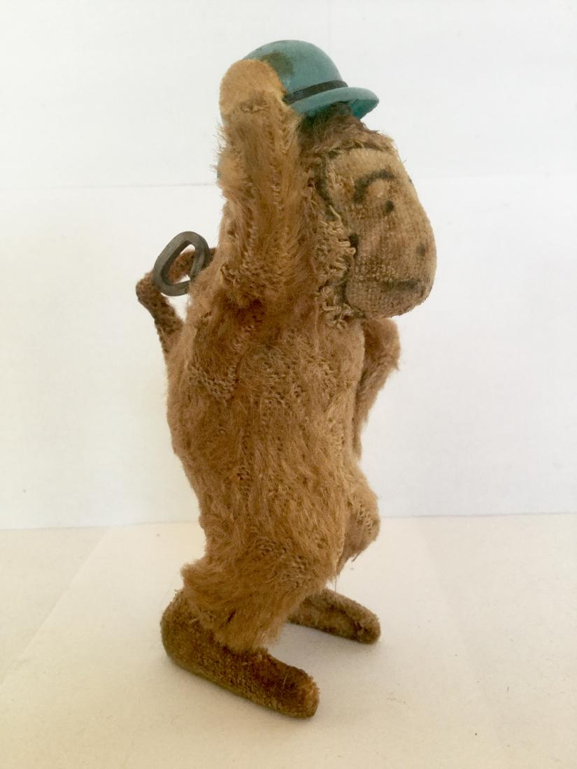Monkey Tipping Hat Wind Up Toy: Monkey Tipping Hat Wind Up Toy, Plush with Celluloid Hat and Cane, Works with Built in Key, Japan, 1950's, 4" tall x 1 1/2" wide x 2 1/4" deep Please note that this lot has a confidential reserve. Whe