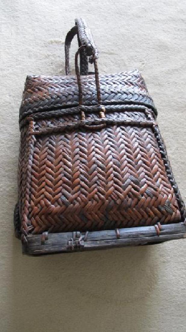 Bontoc Rattan Backpack: Height 13" x 9 1/2" wide x 13" diameter. "The Bontoc "sangi" is an everyday backpack much like the Ifugao "hape-eng." The sangi has heavy, plaited rattan shoulder straps." This comes with a certificat