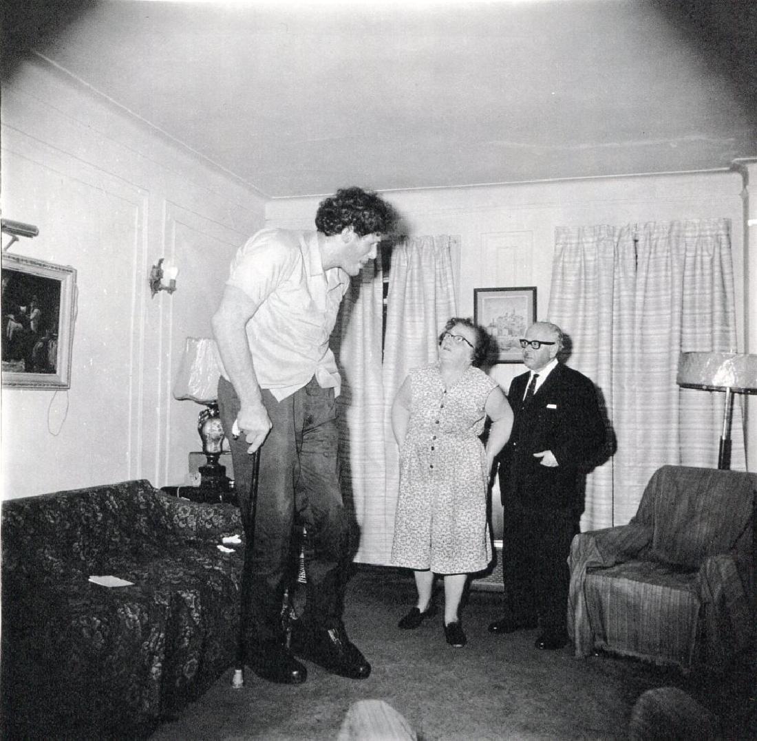 DIANE ARBUS - A Jewish Giant, NY 1970: Artist: DIANE ARBUS Print Title: A Jewish Giant at home with his parents in the Bronx, NY 1970 Medium: Heliogravure Printed in 1979, Italy Paper Size: 15 3/4 x 11 5/8 in Image Size: 9.5" x 9.5" Diane 
