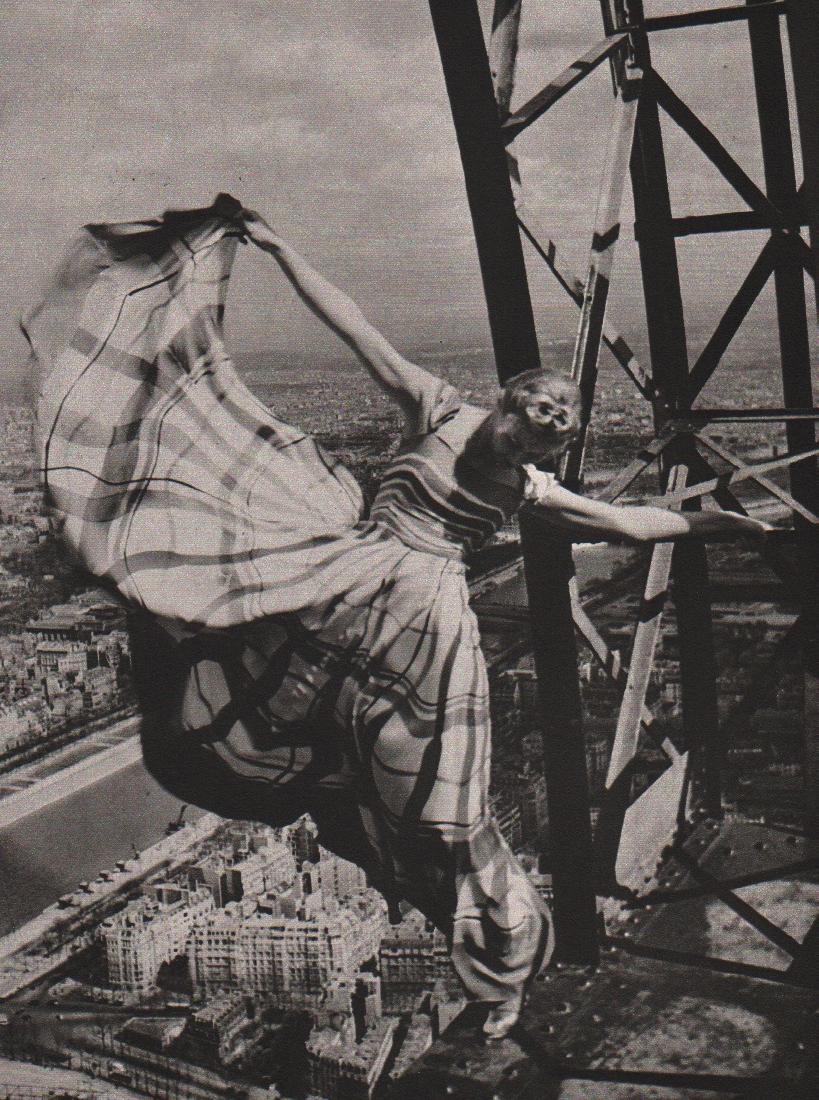 ERWIN BLUMENFELD - Lisa on the Eiffel Tower, Paris 1939: Artist: ERWIN BLUMENFELD Print Title: Lisa on the Eiffel Tower, Paris, 1939 Medium: Heliogravure Printed in 1981, Italy Paper SIze: 15 3/4 x 11 5/8 in Image Size: 8.5" x 11". Erwin Blumenfeld was a Ge