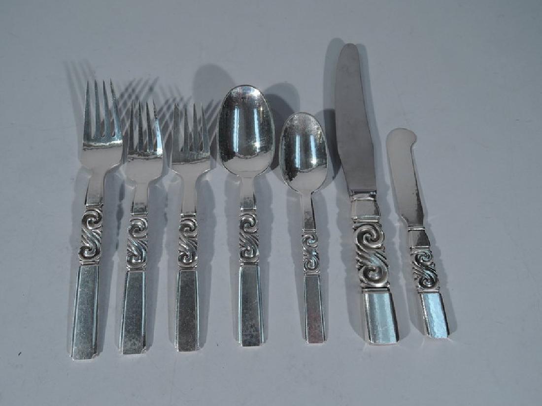 Georg Jensen Scroll Sterling Silver Dinner Set for 12: Georg Jensen Scroll Sterling Silver Dinner Set for 12 with 93 Pieces. Made by Georg Jensen in Copenhagen. The pattern was designed by Johan Rohde and first produced in 1927. Soup spoons have oval bowl