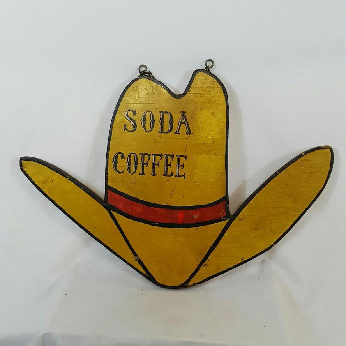Cowboy Hat Coffee And Soda Sign: Cowboy hat coffee and soda sign ca 1930's. Dimensions: 23 1/2 wide x 16 1/2 high. Early laminated wood. Please note that this lot has a confidential reserve. When you leave a bid in advance of the auc