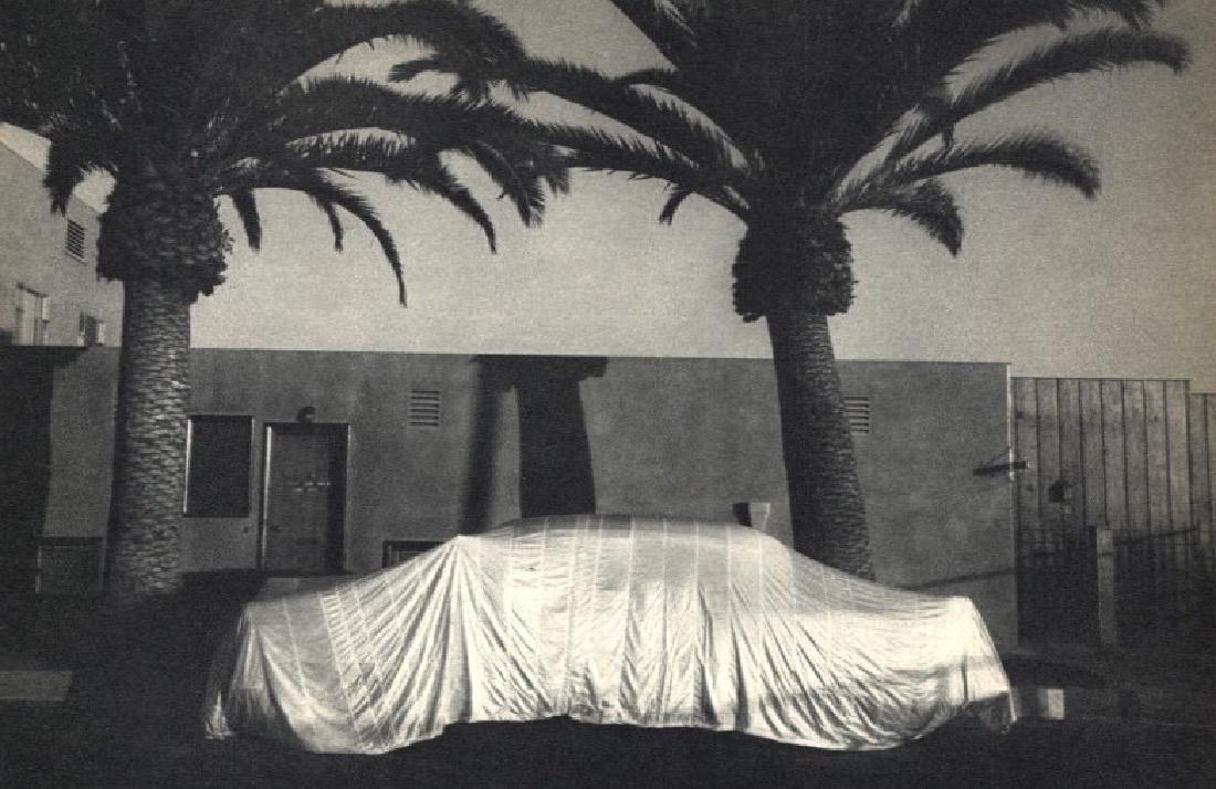 ROBERT FRANK: Covered Car, Long Beach CA: Artist: ROBERT FRANK Print Title: Covered Car, Long Beach CA Medium: Vintage Sheet-fed Gravure Printed in 1958 in France Image Size: 7.5 x 5 inches Robert Frank (b. 1924) is an American photographer a