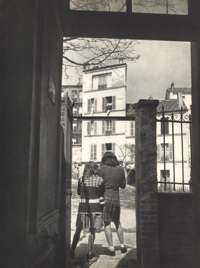 WILLY RONIS - Rue du Transvaal: Artist: WILLY RONIS Print Title: Rue du Transvaal Printing Date: 1954Medium: Sheet-fed Gravure Printed by Braun et Cie in France Image Size approx. 8" x 10" Willy Ronis (1910-2009) was a French photog