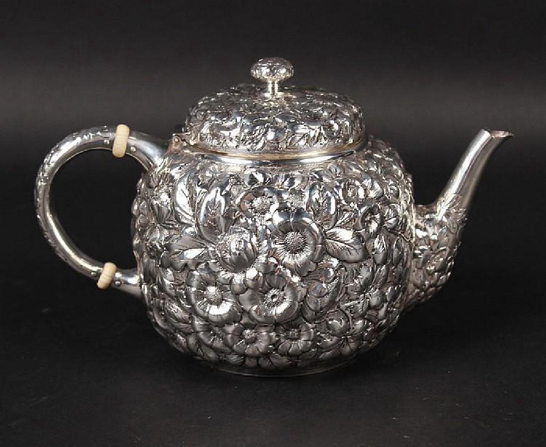 George Shiebler Sterling Silver Floral Tea Pot: Antique American Sterling Silver Hand Chased Floral Tea By George Shiebler. Circa 1900. 5" high. 330 grams Please note that this lot has a confidential reserve. When you leave a bid in advance of the
