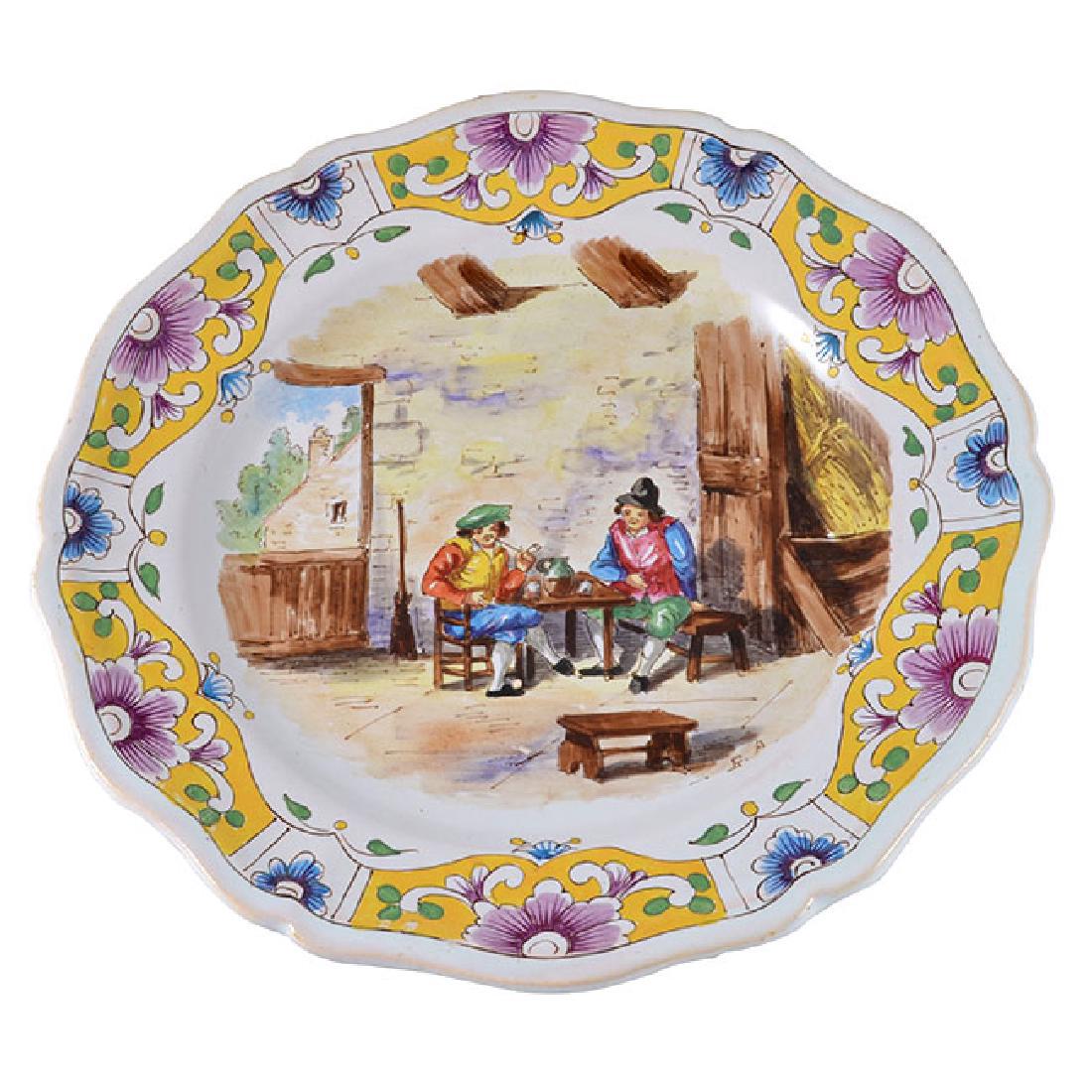 1767 French Lille Faience Plate: 1767 Lille manufactory faience plate hand painted charming French Country old tavern scene, two men’s having a drink and smoking a pipe. Decorated with a beautiful floral border signed artist initia