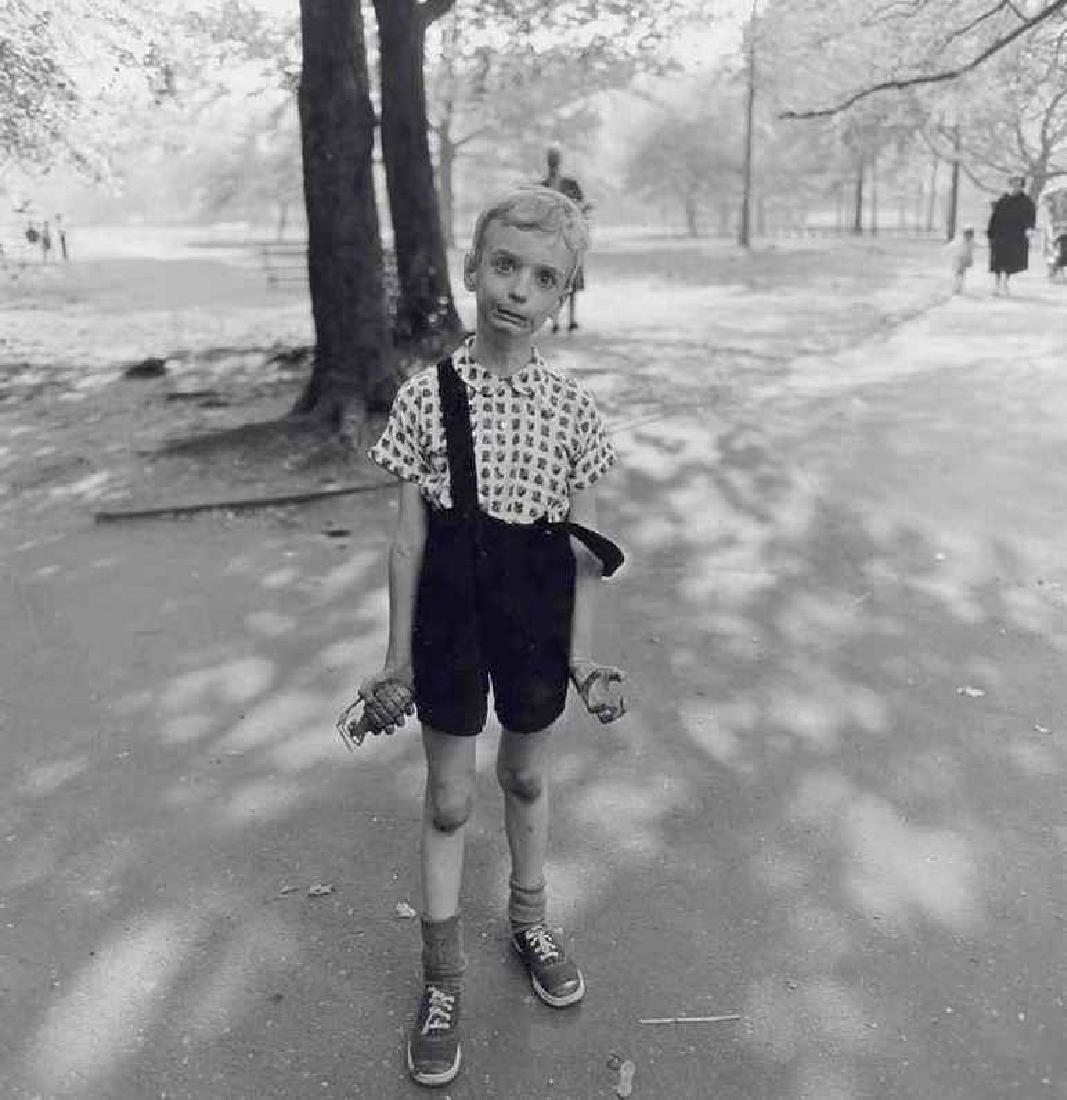 DIANE ARBUS - Child with Toy Hand Grenade: Artist: DIANE ARBUS Print Title: Child with a Toy Hand Grenade in Central Park, New York 1962 Medium: Heliogravure Printed in 1979, Italy Paper Size: 15 3/4 x 11 5/8 in Image Size: 9.5" x 9.5" Diane A