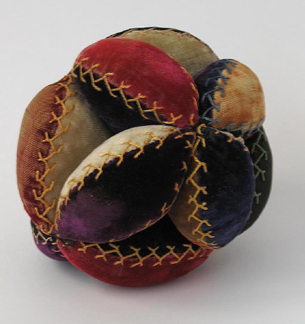 Puzzle Ball With Turkey Work Stitching: Puzzle ball with turkey work stitching. About 4” in diameter Please note that this lot has a confidential reserve. When you leave a bid in advance of the auction, submit your maximum. Jasper52 will 