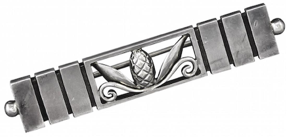 Georg Jensen Sterling Silver Brooch No. 216A: Georg Jensen Sterling Silver Brooch No. 216A. This sterling silver brooch has a central acorn motif designed by Johan Rohde. The brooch measures 1.8 inches long and .325 inches wide. The brooch bears