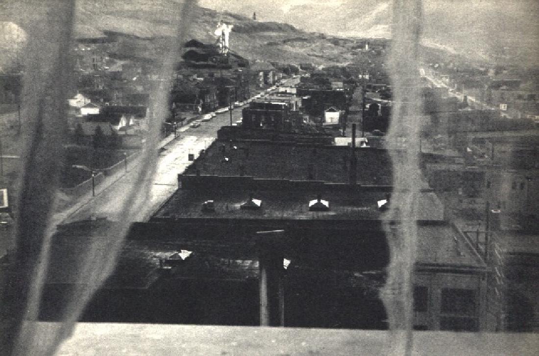 ROBERT FRANK: View from Hotel Window - Butte, Montana: Artist: ROBERT FRANK Print Title: View from Hotel Window - Butte, Montana Medium: Vintage Sheet-fed Gravure Printed in 1958 in France Image Size: 7.5 x 5 inches Robert Frank (b. 1924) is an American p