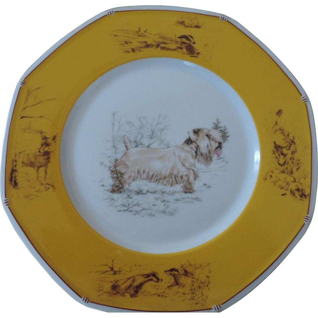 Hermes, Limoges, Sealyham Terrier Dinner Plate: This is a porcelain plate, made by Limoges, for Hermes. It is part of a sporting dogs series, featuring a Sealyham Terrier, in profile, as the center image, in browns, against a white ground. There is