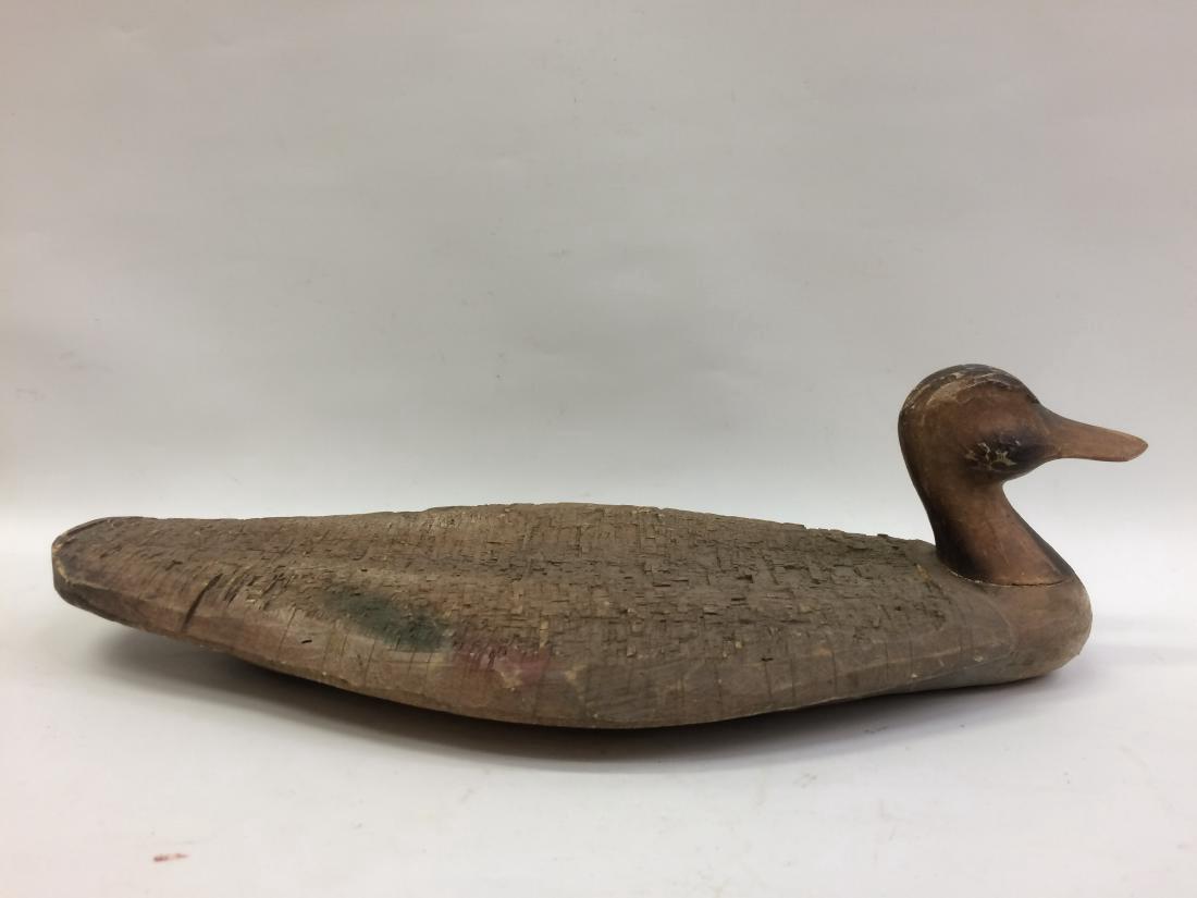 Carved Wood Flat Decoy Duck: Carved Wood Flat Decoy Duck 15' Long Please note that this lot has a confidential reserve. When you leave a bid in advance of the auction, submit your maximum. Jasper52 will bid on your behalf as much