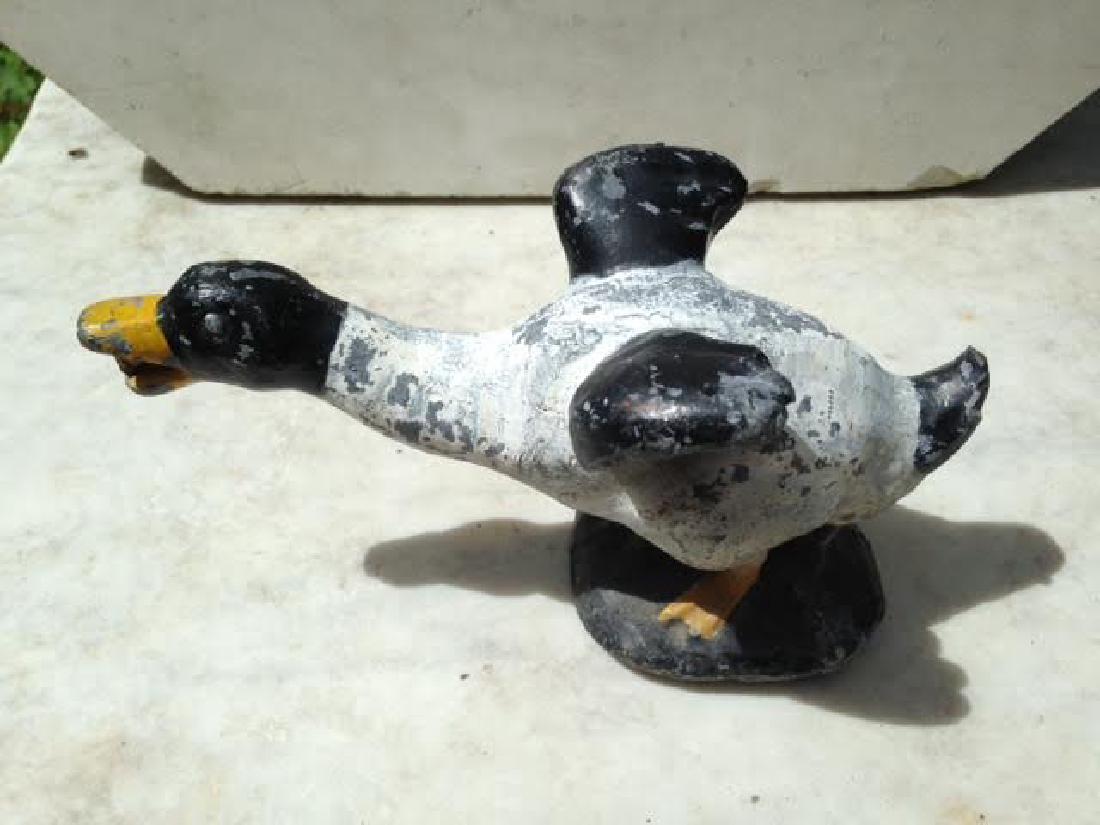 Circa 1900 Lead Fountain Duck: C1900 lead fountain duck in old weather worn paint. There is a tube running through the body for fountain use or just use as a garden ornament. GC. 8 1/2" long by 4 1/2" high. Please note that this 