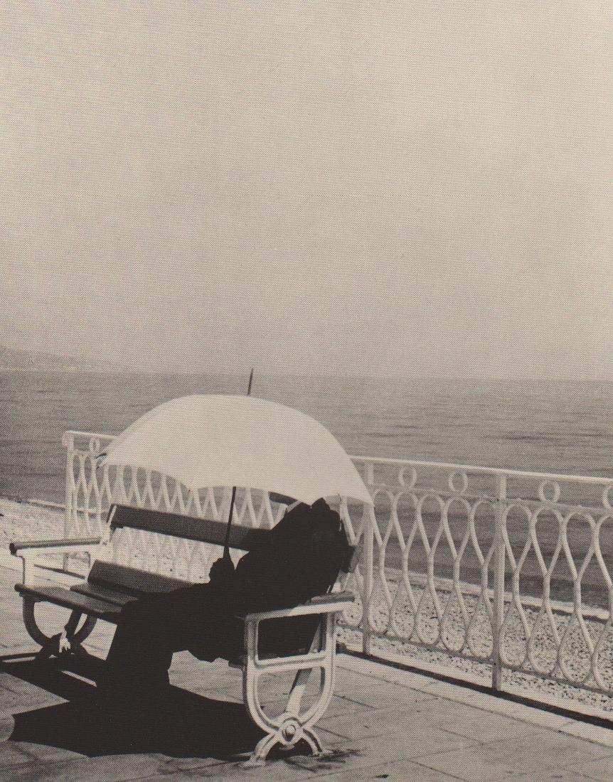 BRASSAI - Man seated under Umbrella: Artist: BRASSAI Print Title: Man seated under Umbrella Printing Date: 1993 Medium: PhotoEngraving Printed: USA Image Size: 9" x 12" - Paper 11x14" (photographer name & year taken appears on left below