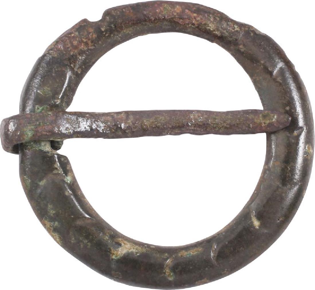 ANCIENT VIKING PROTECTIVE BROOCH 10th CENTURY: Circular, bronze, 7/8” diameter. Worn in numbers on the surface of the jerkin, these small metal brooches provided a measure of protection against sword cuts and in fact, were a form of armor. See c