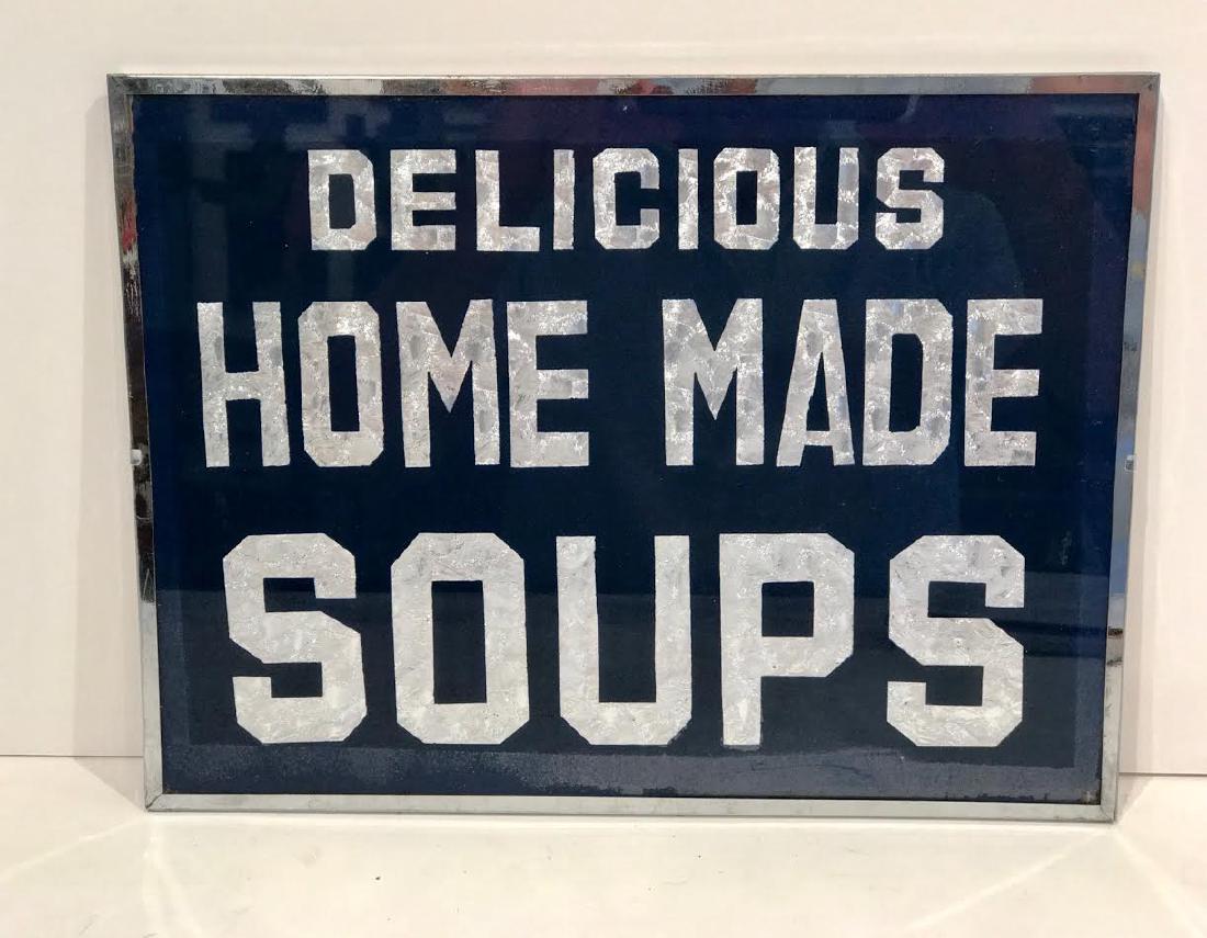 Vintage Delicious Home Made Soups Sign: Vintage DELICIOUS HOME MADE SOUPS sign. Reverse glass on foil backing with original metal frame. Size: 9 h x 12 w. Date: Early Twentieth Century Please note that this lot has a confidential reserve. W