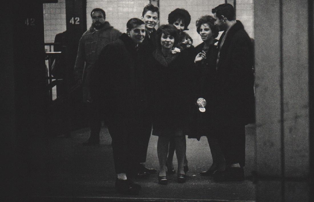 GARRY WINOGRAND: Love in the Subway II: Artist: GARRY WINOGRAND Print Title: Love in the Subway II Printing Date: 1962 Medium: Sheet fed Copper plate gravure Printing Location: USA Image Size: 9 x 6 inches Garry Winogrand (1928-1984) was a
