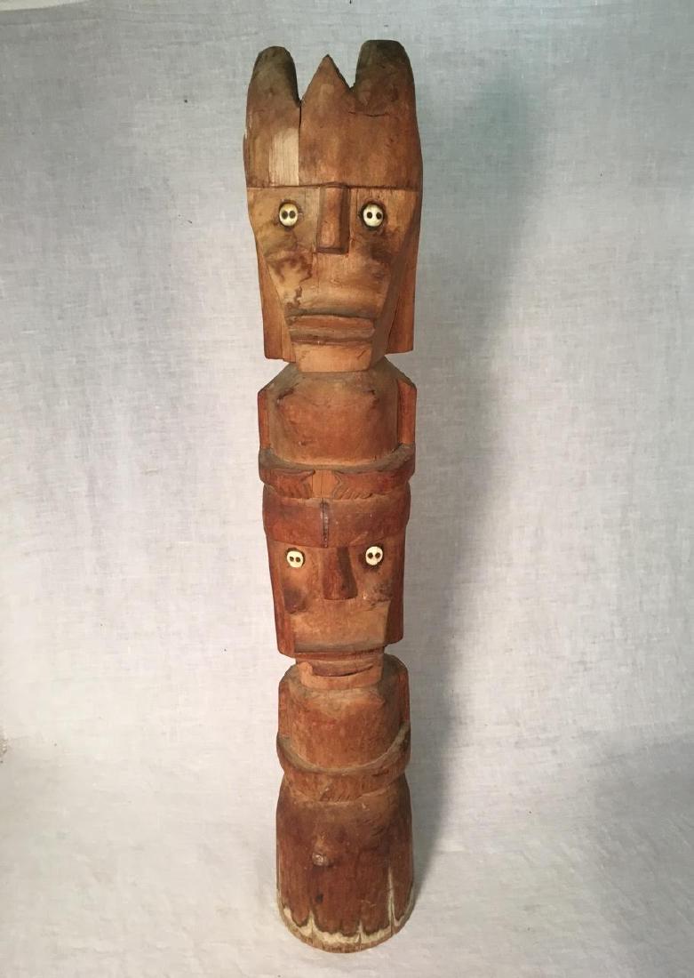 Carved Pine Totem Found in Adirondacks: Carved Pine Totem Found in Adirondacks Carved Pine Totem Found in Adirondacks. Carved pine totem with inlaid bone button eyes. C. 1930-1930. Found in old camp in the Adirondacks. 30” tall by 4” in