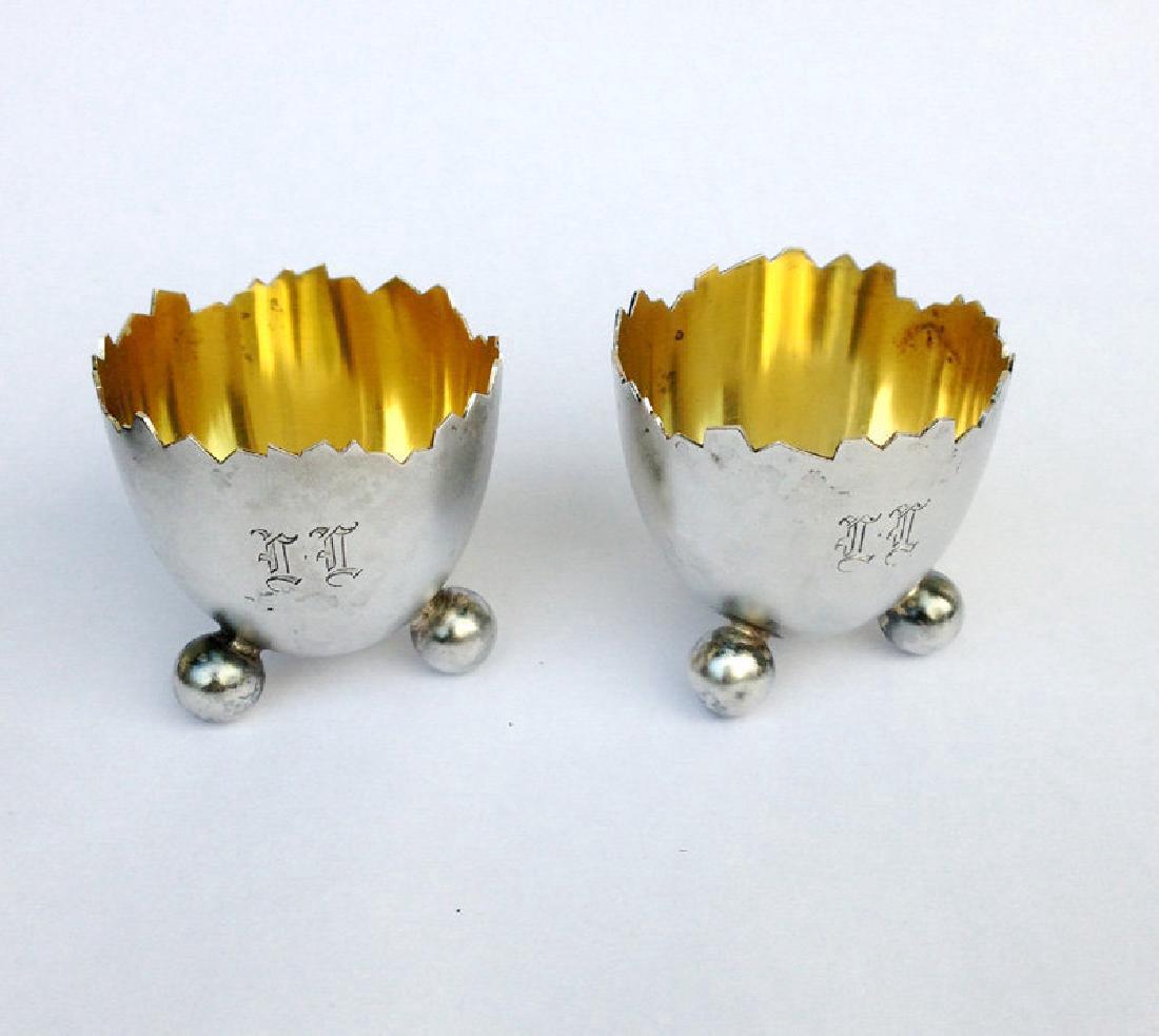 Vintage Kultateollisuus Cracked Egg 813 Silver Salts: A pair of sterling silver salts in the shape of cracked eggs, the exterior being matt polished and the interior gilt. A charming 19th Century ”novelty” design. These salts are somewhat later and w