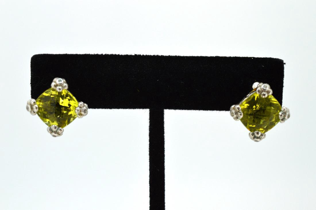 Judith Ripka Sterling Yellow-Green Topaz Lever Earrings: 10x10mm Yellow-green faceted topaz set in .925 sterling silver, bordered with cubic zirconia and flowers, 4.6dwt Please note that this lot has a confidential reserve. When you leave a bid in advance o