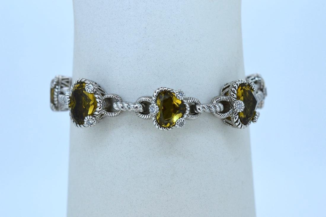 Judith Ripka Sterling Silver Yellow Topaz Bracelet: Judith Ripka 7" Sterling Silver and Yellow Topaz Bracelet. Seven (7) Heart shaped topaz stones set in sterling silver with cubic zirconia accents, 11mm cz ball accent near lobster clasp. Hearts are 12