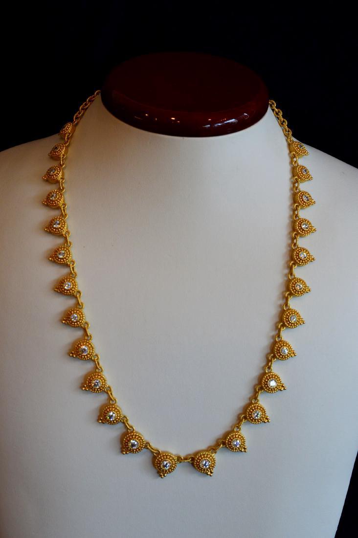 Judith Ripka Gold Clad Medallion Necklace: Judith Ripka 20" Gold Clad Medallion Necklace with Cubic Zirconia. 12x10mm Round Gold Clad Medallions with Cubic Zirconia in center on 20" gold clad necklace, 32.3 dwt Please note that this lot has a