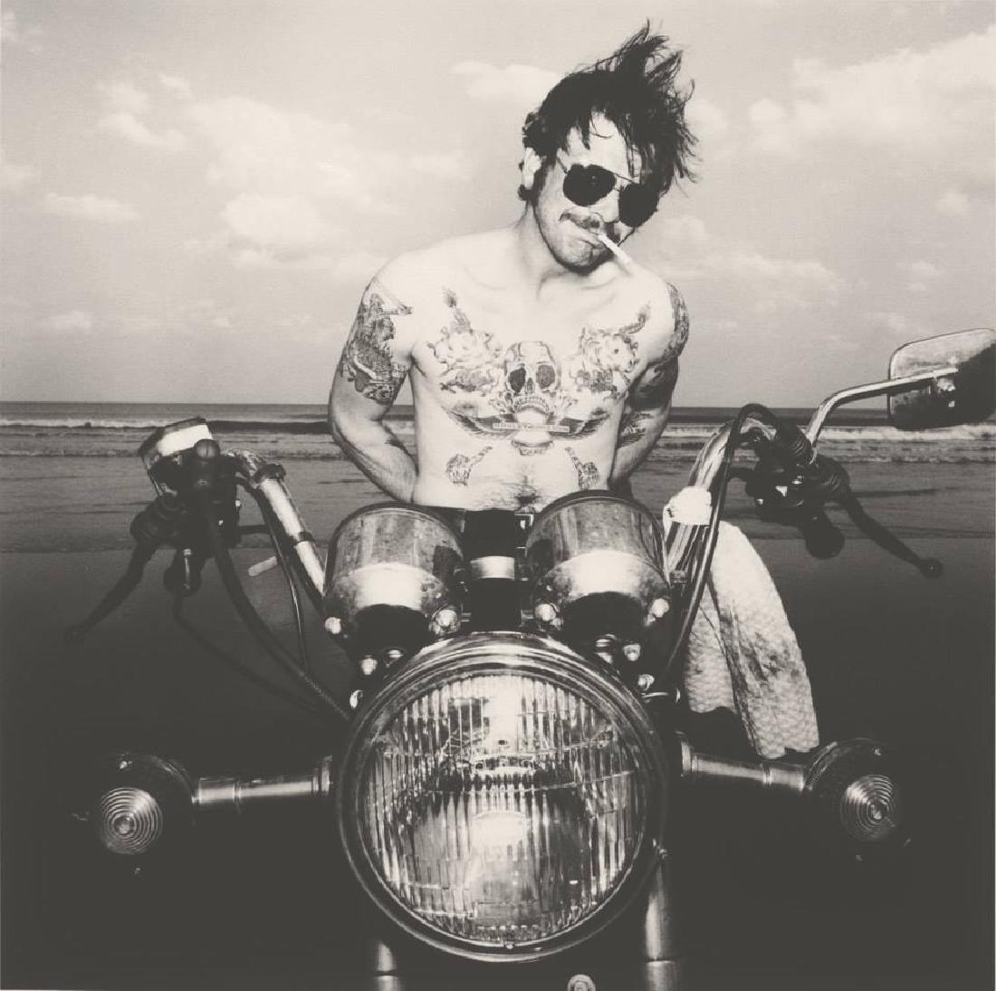 BURK UZZLE - Daytona Beach 1983: Artist: BURK UZZLE Print Title: Daytona Beach 1983 Printing Date: 1985 Medium: Sheet-fed Gravure Printed in NANCY, France Image Size approx. 8" x 8" Burk Uzzle is an American photojournalist, previous