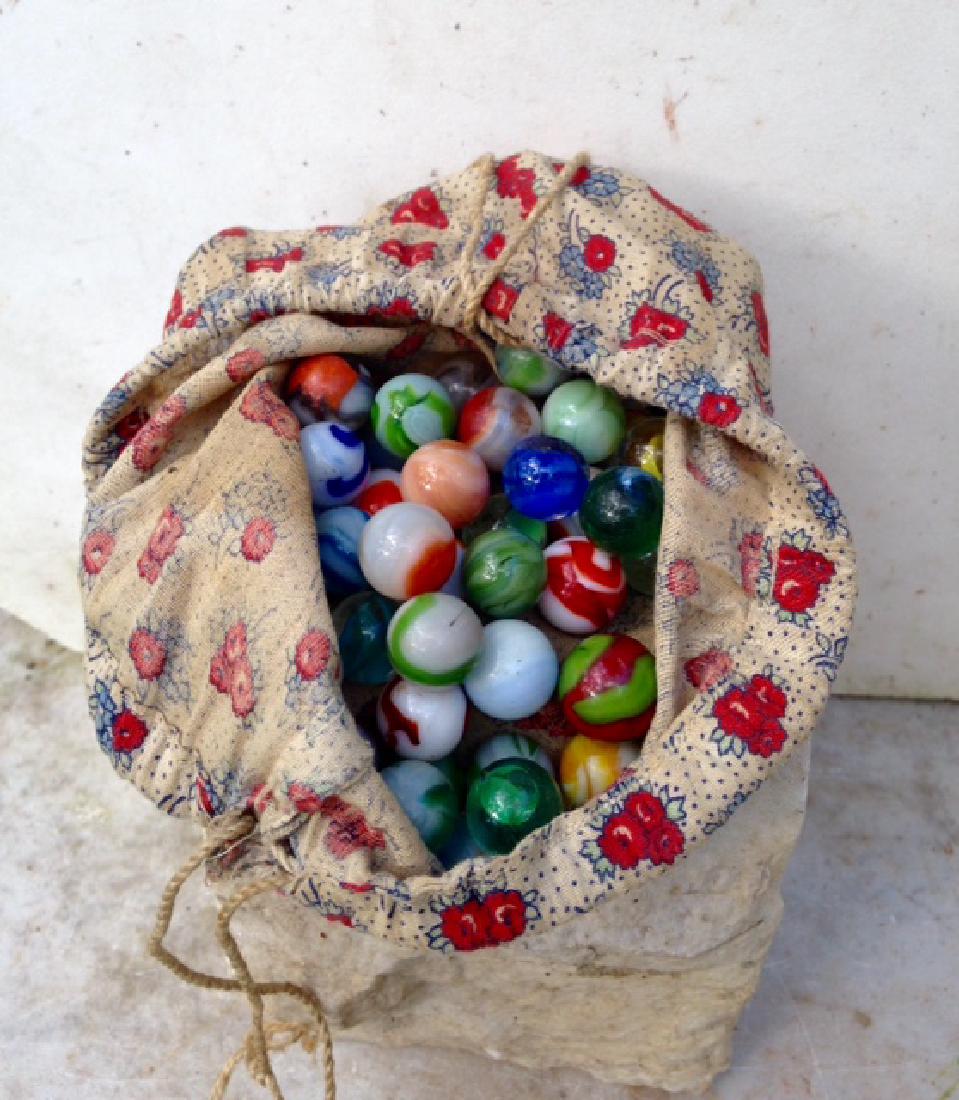 Lot of Mid 20th Century Marbles: Lot of old mid 20thc marbles in original bag. Please note that this lot has a confidential reserve. When you leave a bid in advance of the auction, submit your maximum. Jasper52 will bid on your behal