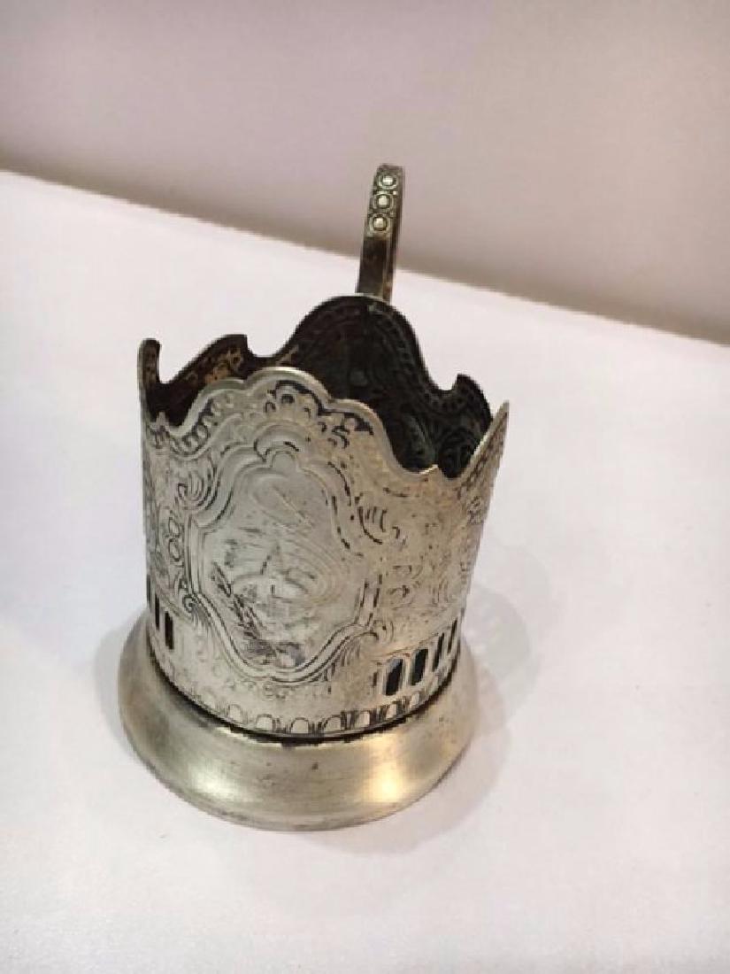 Antique Russian Silver Plated Candle Holder: Item: Antique Silver plated Candle Holder Maker/Designer: MHU.U.2P09 Date/Period: Antique Silver Purity: R Size: 11X8.5 cm Item Weight: 172 g Hallmarks: MHU.U.2P09 Russian Antique Silver Please note t