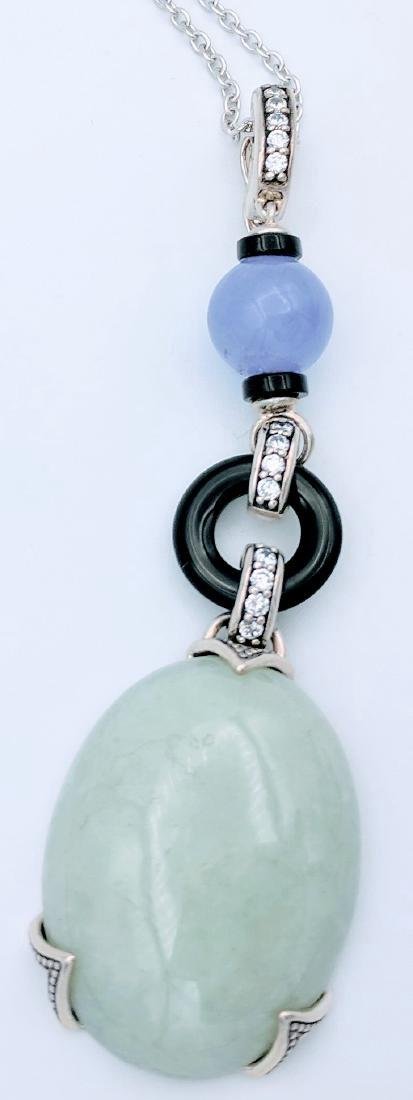 Sterling Silver Jade Chalcedony Cubic Zirconia Pendant: Item: Pendant with Jade Stone Dangled from a Round Purple Chalcedony and a Black Loop Brand: Jean Lin Collection Metal Purity: 925 Sterling Silver Gemstones: Jade, Purple Chalcedony & Cubic Zirconia T