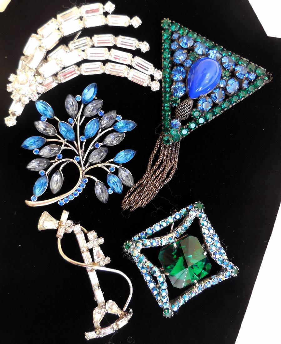 Lot of Vintage Rhinestone Costume Brooches, 1920s-50s: Item: Lot of Rhinestone Costume Brooches Maker: Unknown Origin: Unknown Date: 1920s-1950s Materials: Variety Metals, Glass Size: 1.5 - 3 inches long This sparkling variety of 5 costume brooches contai