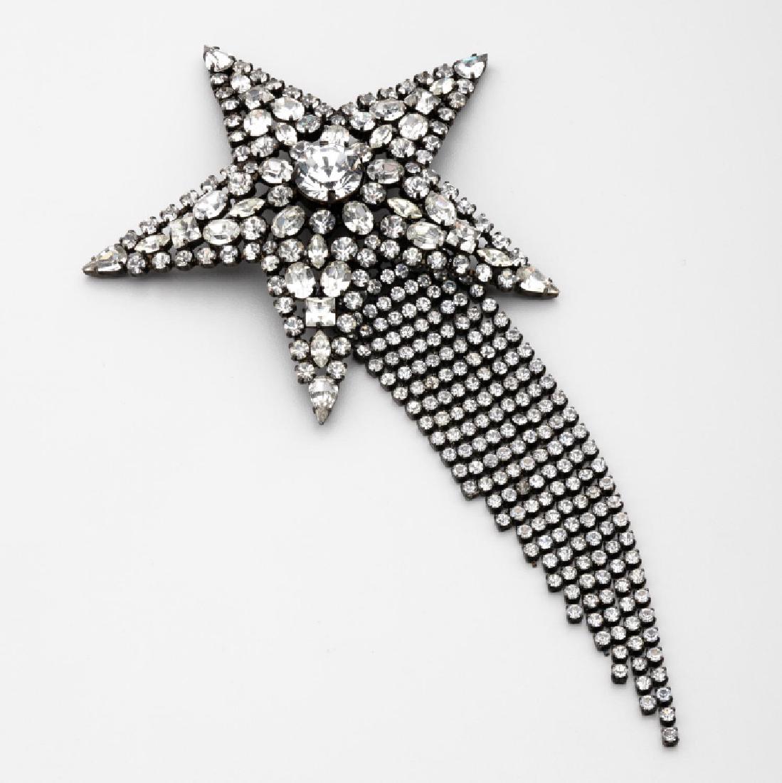 Vintage Butler & Wilson Shooting Star With Tail Brooch: Fabulous vintage Butler & Wilson featuring a sparkling Shooting Star with dangles brooch set with clear faceted rhinestones; black-tone metal; measuring approx 8 inches high & 4.25 inches wide. Marked