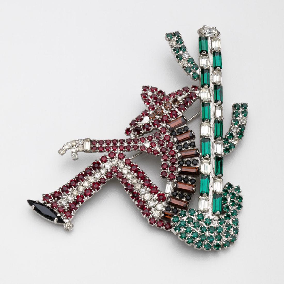 Vintage Butler & Wilson Sleeping Mexican Cactus Brooch: Fabulous vintage Butler & Wilson featuring a sparkling Sleeping Mexican against a Cactus brooch set with black, red, green and clear faceted rhinestones; silver-tone metal; measuring approx 3.375 inch
