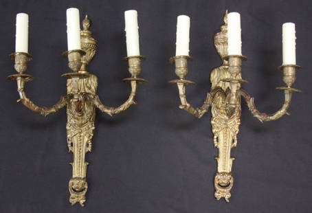 Pair of Three-Armed French Bronze Sconces: Pair of Three-Armed French Bronze Sconces. Lovely pair of cast bronze sconces with a nice patina: top flame and urn with decorative leaf body and central bow decoration descending to another bow,