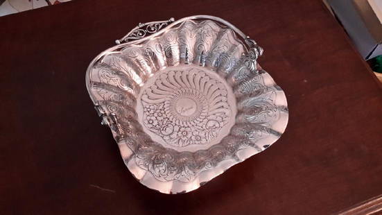 Victorian Silverplate Bride's Basket: James W. Tufts 10.5H x 9.5W x 9.5D 1890 Fully Hallmarked on Base James Tufts Boston Warranted Quadruple Plate 2763 Please note that this lot has a confidential reserve. When you leave a bid in