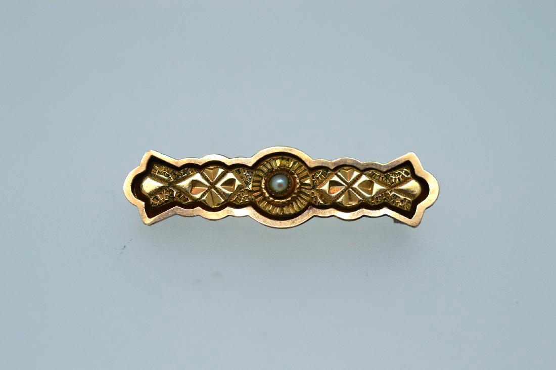 Edwardian English 10K Gold Seed Pearl Enamel Pin: Item: Ladies English Edwardian 10k Yellow Gold Pin with Seed Pearl & Black Enamel Metal Purity: .416 Yellow Gold Gemstones: Pearl 10k Yellow Gold Pin with small seed pearl surrounded by black enamel, 