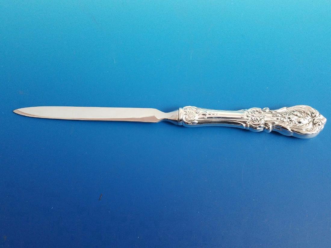 Reed & Barton Francis I Sterling Silver Letter Opener: Francis I by Reed & Barton Sterling Silver Letter Opener. It measures approximately 8" long.This custom made letter opener has a sterling Francis I handle and stainless steel attachment. The piece is 